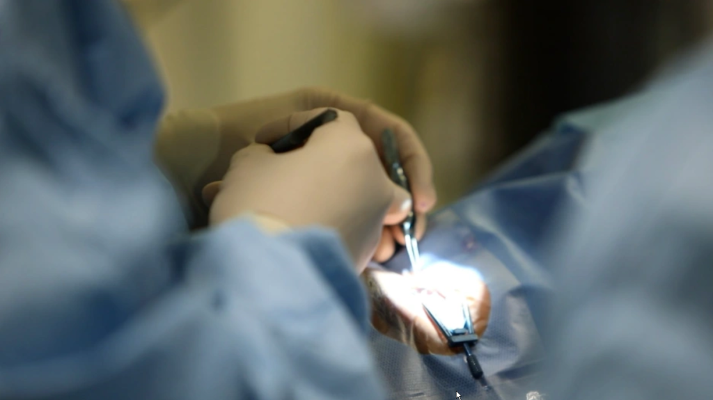 A doctor performs a preoperative examination for a young patient with cataracts