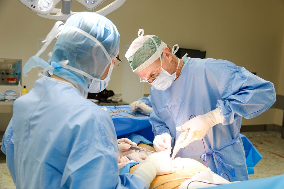 Prof McKay McKinnon performing surgery on a patient.