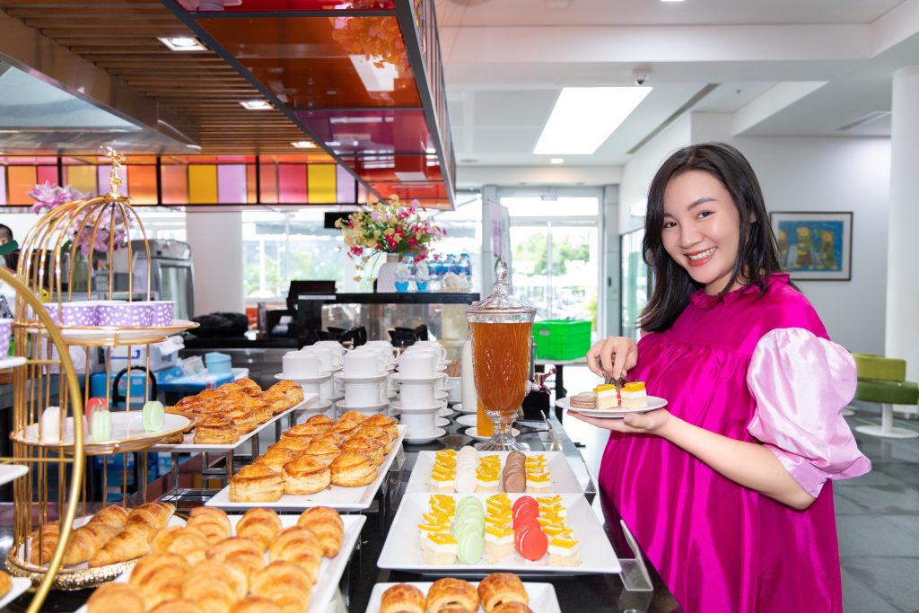An expectant mother enjoys tea and pastries specially prepared by FV Bistro’s chefs.