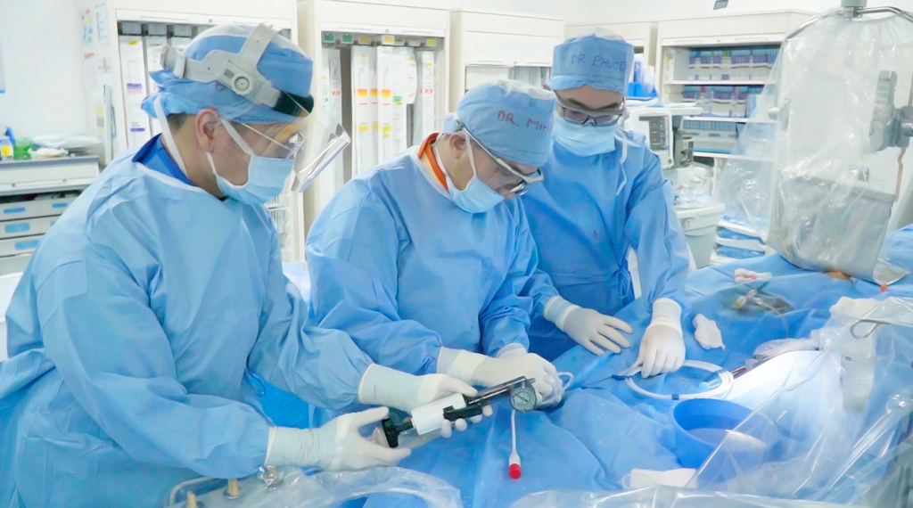 Ho Minh Tuan, MD, PhD (centre) performing a coronary intervention in the Cathlab. 